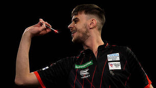 Michael van Gerwen survives scare to reach World Championship second round