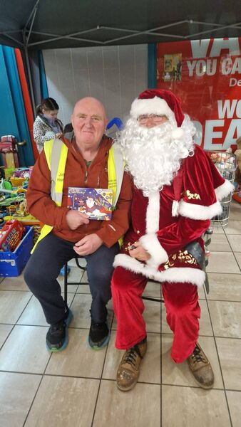 Cllr John Hearne and Santa at Lisduggan Shopping Centre.