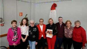 <p>Social Club Committee members welcoming Eileen Condon to this years Christmas Party in Ballymacarbry.</p>