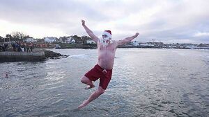 Crowds brave chilly temperatures for Christmas Day swim