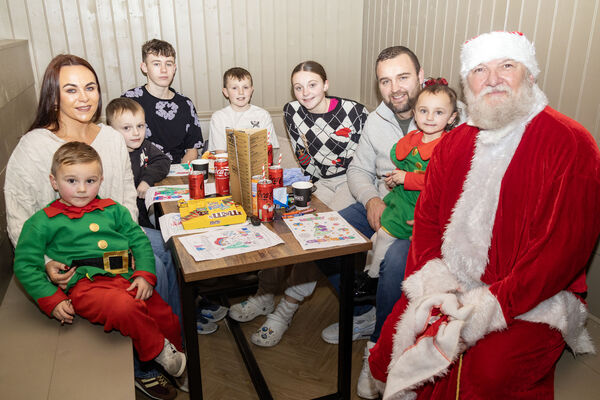  Santa paid a surprise visit to Moes Tramore and is pictured here with members of the hogan family. Photo: Joe Evans