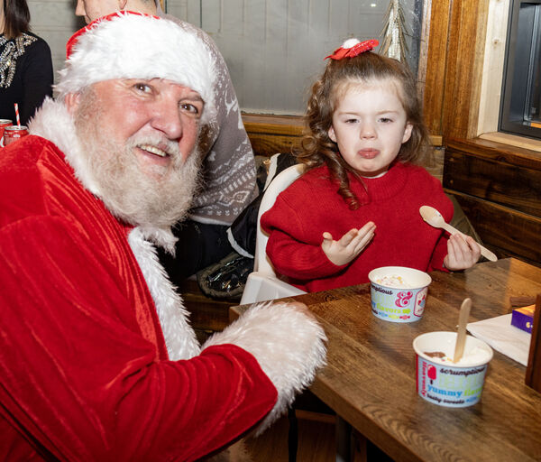  Santa paid a surprise visit to Moes Tramore and is pictured here with Indi. Photo: Joe Evans