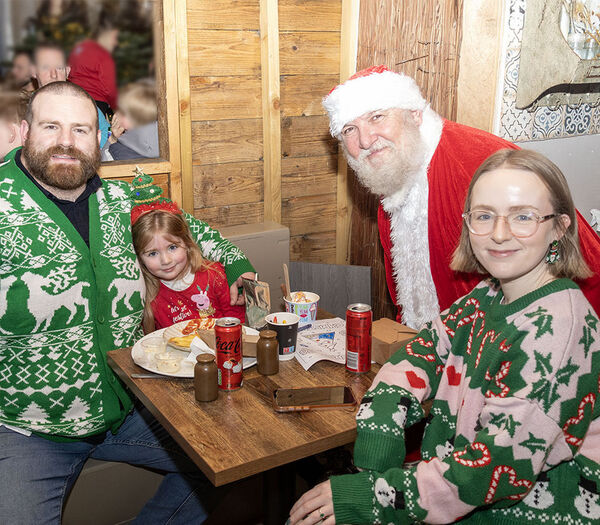  Santa paid a surprise visit to Moes Tramore and is pictured here with members of the Kennedy family. Photo: Joe Evans