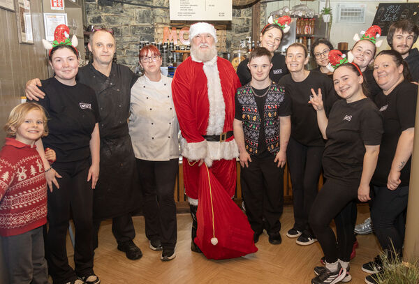  Santa paid a surprise visit to Moes Tramore and is pictured here with members of staff. Photo: Joe Evans