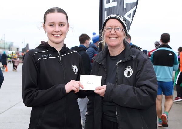 Nora Storey, Chairperson, Tramore AC presents the Women's Junior Baldy Man Run winner Ruth O'Leary, Tramore AC with her prize. Nora Storey, Chairperson, Tramore AC presents the Women's Junior Baldy Man Run winner Ruth O'Leary, Tramore AC with her prize.