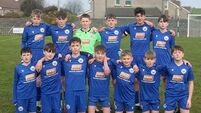 Dungarvan earn a late share of the spoils