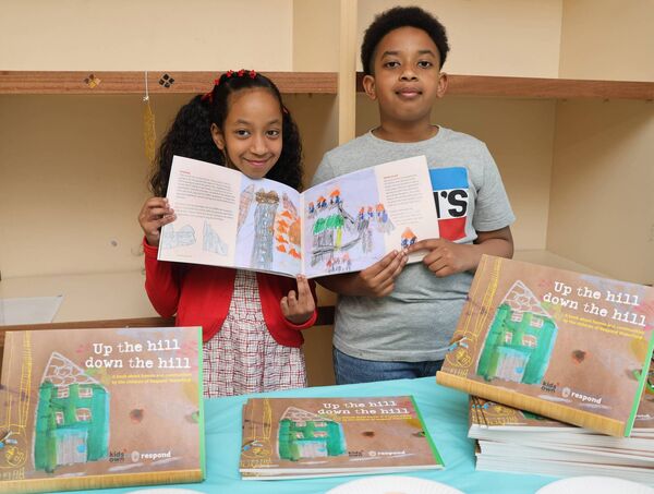 Fatima and Mahmoud, pictured at Killue Grove to launch, Up the hill down the hill, a book about homes and communities by the children of Respond Waterford. Photo: Joe Evans