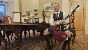 <p>James Stone with his pipes, awards and scroll. Picture by Shannon Sweeney.</p>