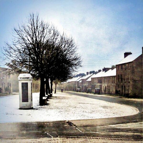 1960s, Barrack Street under Snow A serene winter scene on Barrack Street in Waterford City, before the traffic lights were installed. I love the old telephone box standing there, a relic of simpler times, when the late Skinny Fanning sold fresh mackerel on Saturday mornings. 