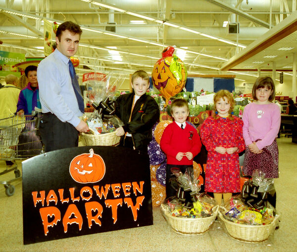  Pictured at Tesco Poleberry, where Ray Morrissey, manager presented Halloween hampers to Daryl Purcell, winner of the Waterford News &amp; Star/Tesco competition and Steven Heatherton, Anna Crotty and Hanna Healy, all winners of the Tesco Creche Halloween Colouring Competition back in 2000.