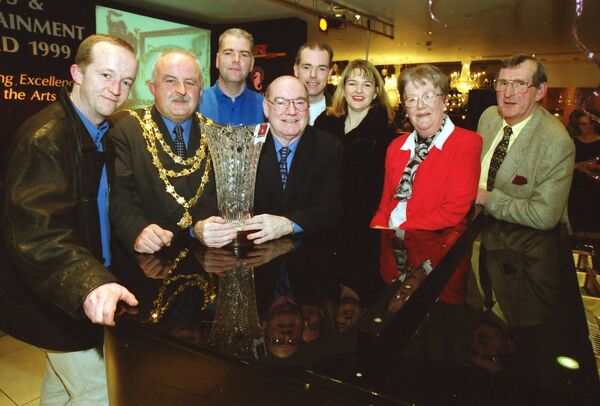 Denny Corcoran was presented with a Lifetime Contribution to Theatre Award back in 2000 for the Waterford Crystal/ WLR FM Arts and Entertainment Awards. Pictured from left, Davy Sutton, Mayor of Waterford Ald. Pat Hayes, Paul Corcoran, Denny Corcoran, Mark Corcoran, Anne Corcoran, Marion Corcoran and Nicky Cummins.