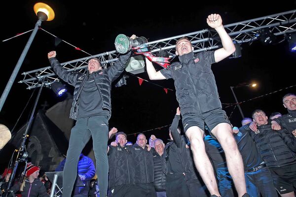 Ballygunner joint captains Peter Hogan and Mikey Mahony lift the cup at the homecoming in Ballygunner on Sunday night. Photos: Noel Browne