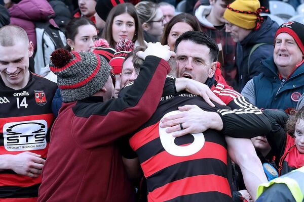 Ballygunner's Philip Mahony is mobbed by fans after the game.