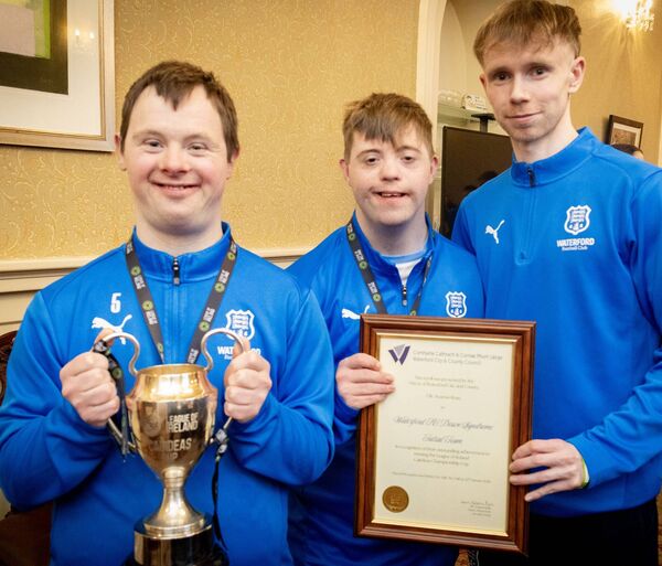 John Mulligan and Wayne Pepper with their coach Dylan Carroll at City Hall for a Mayoral reception by Mayor of Waterford City &amp; County Cllr. Seamus Ryan, for Waterford FC Down Syndrome Futsal Team. Photo: Joe Evans