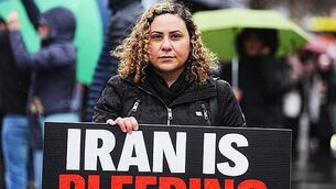 Woman arrested after man injured in Cork house fire