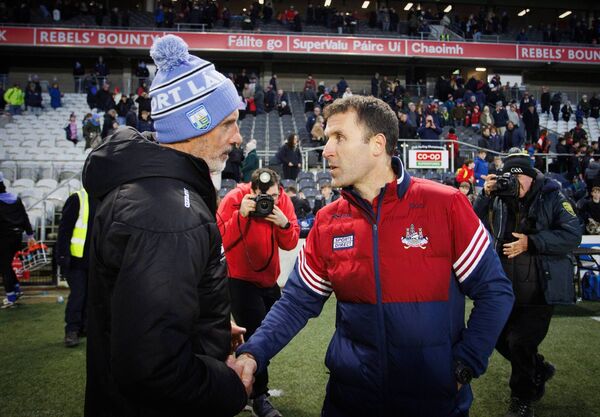 Waterford manager Peter Queally and Cork manager Ben O'Connor shake hands after the game. Photos: INPHO/Tom Maher