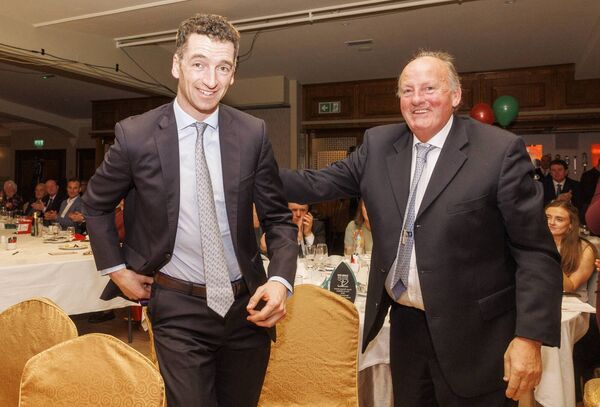 Patrick Mullins is congratulated by Michael Morrissey as he makes his was to the stage after being announced as the Carlow Sports Person of the Year.