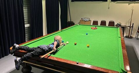 Two-year-old snooker prodigy secures two Guinness World Records for trick shots
