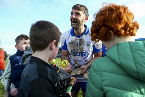 A mud spattered Patrick Curran with Déise fans at the end of the game. 