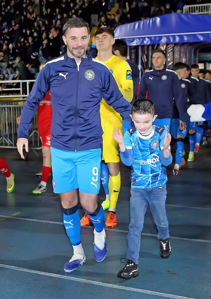 Waterford FC captain Padraig Amond leads out his team at the RSC for the first home game of the season with mascot Leon Thompson. Photo: Noel Browne