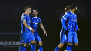 <p>Waterford FC's Padraig Amond congratulates Tommy Lonergan after his goal gave the Blues a share of the spoils in their opening SSE Airtricity Men's Premier Division game with Shelbourne at the RSC. Photo: INPHO/Ken Sutton</p>