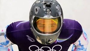 IOC urges Ukrainian racer to compete amid row over banned war victim helmet