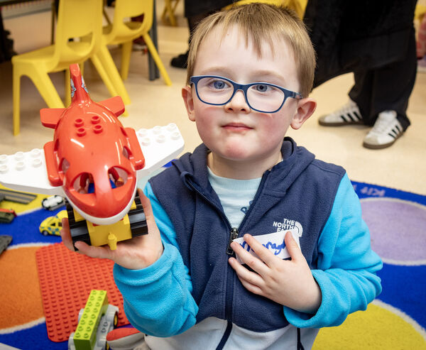  Darragh shows off the plane he made at Glor na Mara's open evening. 