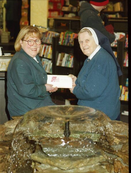 Paula Flynn in the year 2000 presenting a cheque to Sr. Imelda, The Sacred Heart Day Centre.