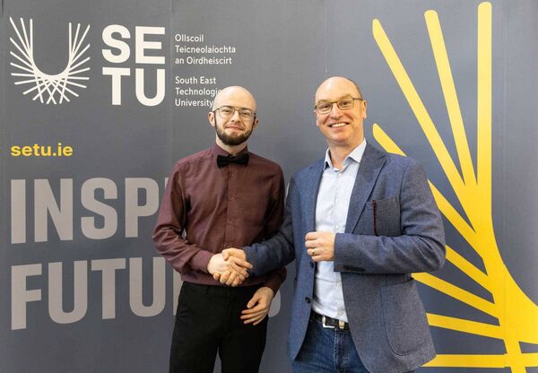 John L Byrne congratulates Cian at the event. Pic: SETU.ie