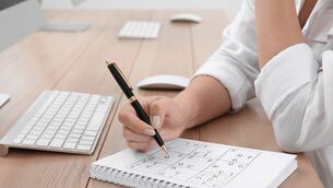 <p>Woman solving sudoku puzzle at table. Pic: iStock</p>