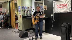 <p>Derek Flynn performing at Slip of the Tongue at the Theatre Royal Bar. 	Photo: Libby Marchant</p>