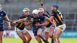 <p>Waterford's Reuben Halloran tries to burst through the challenge of Kilkenny's Paddy Deegan, Liam Moore and John Donnelly.</p>
