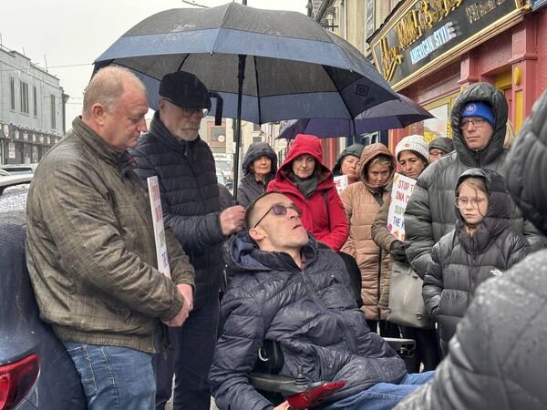 Disability activist Karl Cretzan spoke at the protest