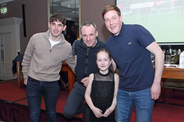 Panelists Darragh O'Keeffe, Sean Flanagan and Declan Queally pictured with a young racing fan in the Tower Hotel.
