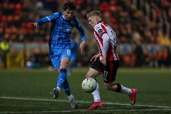 Waterford FC's Luke Heeney in a battle for possession with Derry's Josh Thomas. 