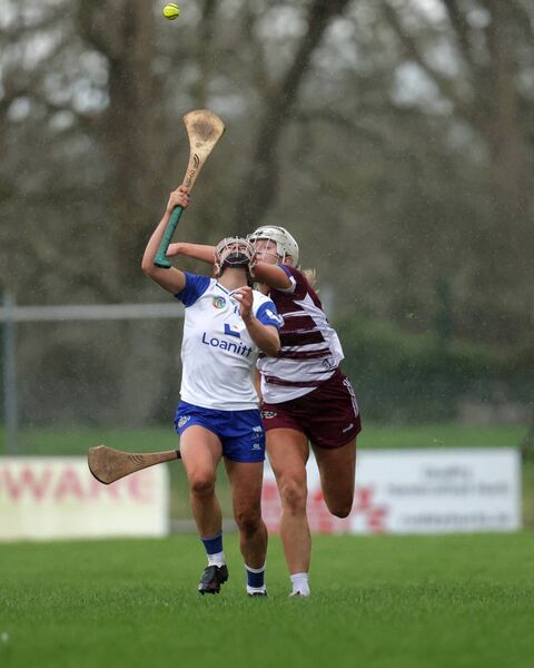 Waterford's Eimear O’Neil is challenged by Galway's Anna Porter as they go high for possession. 