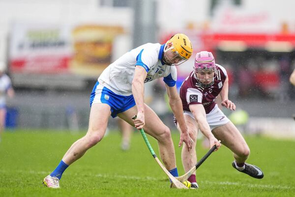 Waterford's Sean Walsh and Galway's Cillian Travers try win possession of the sliothar. 