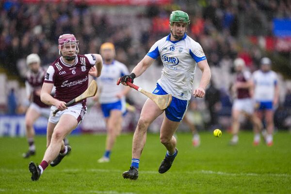 Waterford's Michael Kiely gets out in front of Galway's Cillian Travers. 