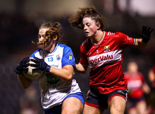 Waterford's Chloe Fennell in action against Cork's Dara Kiniry. Waterford's Chloe Fennell in action against Cork's Dara Kiniry.