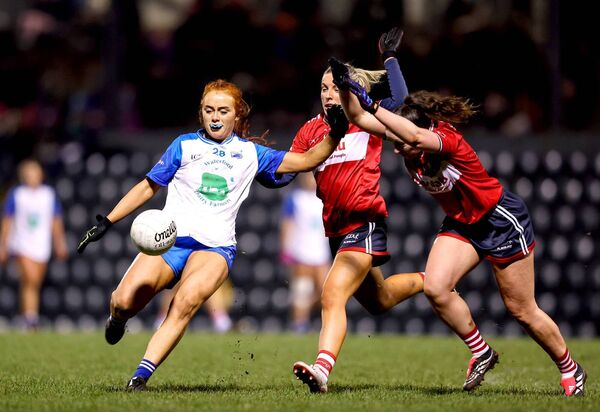 Waterford's Maeve Daly has this kick blocked down by Cork's Shauna Kelly. Waterford's Maeve Daly has this kick blocked down by Cork's Shauna Kelly.