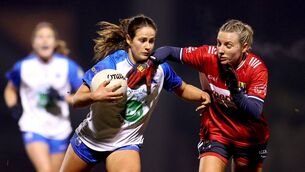 <p>Waterford's Áine O'Neill in a challenge with Cork's Emma Cleary.</p>