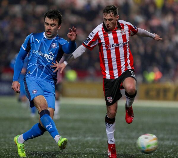 Waterford FC's John Mahon in a battle for possession with Derry's Gavin Whyte. Waterford FC's John Mahon in a battle for possession with Derry's Gavin Whyte.