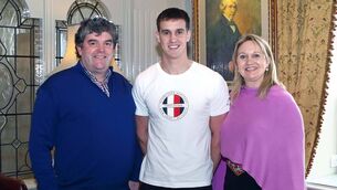 <p>The late Benny Kiely with his son, Michael, and his wife Dolores after Michael was named a WLR/Granville Hotel GAA award winner. Photo: Noel Browne</p>