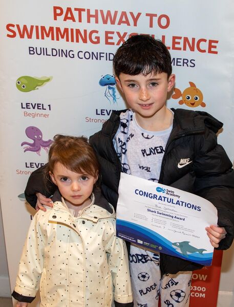  Beau Johnston receiving his Level 7 Swimming Cert at Kingfisher recently. Included is Rue Johnston.