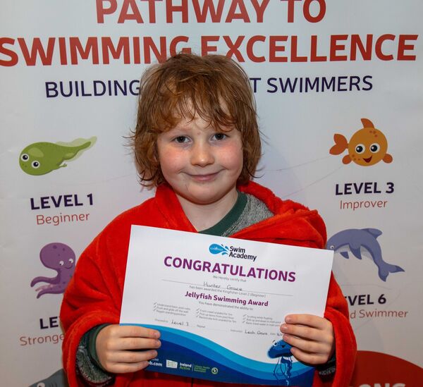  Hunter Grace receiving his Level 3 Swimming Cert at Kingfisher recently. 
