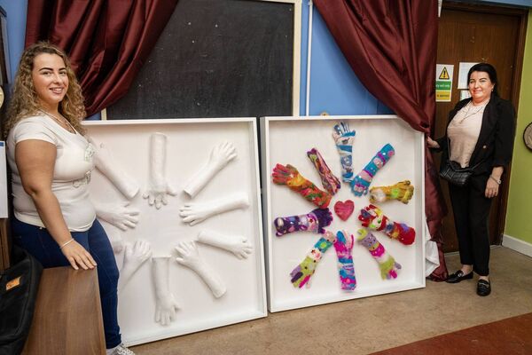 Grace Moran and Frances Troy unveil the 'Hands' sculpture project by Mincéirí Port Láirge at Oasis House. 	Photo: Joe Evans