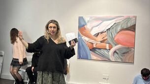 <p>The artist Jen Wade explaining her work.</p>