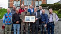 Mount Sion past pupils present class reunion photo to Waterford principal 