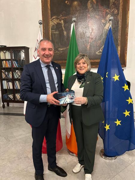 Minister Butler presents Jo Etienne Abela, the Maltese Minister for Health, with Waterford Crystal