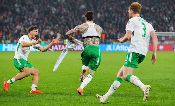 Ireland's Troy Parrott celebrates with Jayson Molumby after scoring the winning goal of the match against Hungary that saw qualification for the playoffs. 